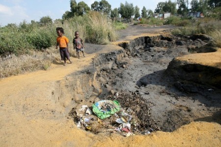 An area, which is built on an old mine dump, where part of the ground has sunk. (© Veli Nhlapo @ Sowetan)