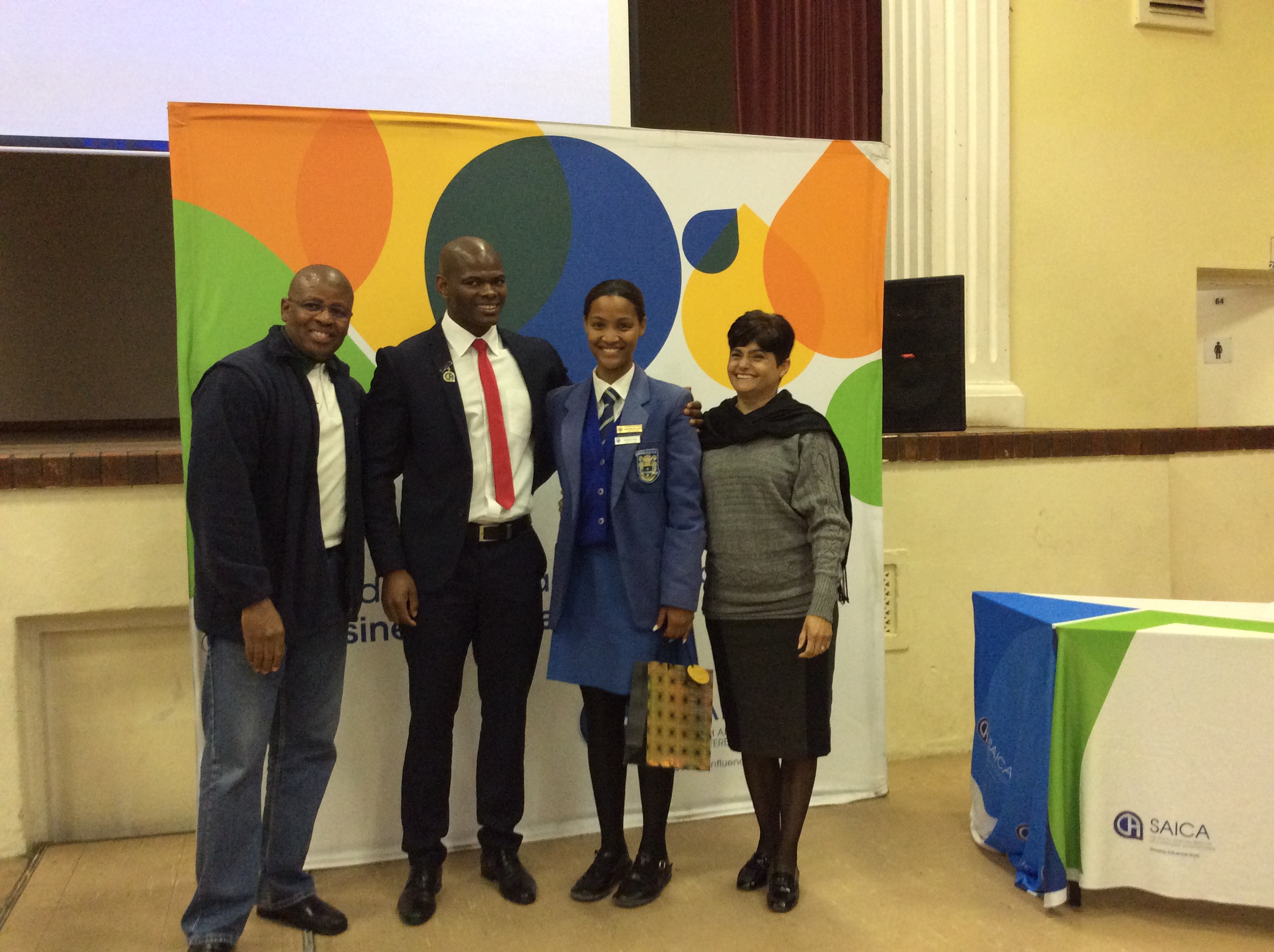 Western Cape Thuthuka Camp top maths learner, Jianni Williams, with Dr Terence Nombembe (SAICA CEO), Sandile Philip (SAICA Southern Region President) and Dr Glynis Schreuder (Western Cape Education Department).