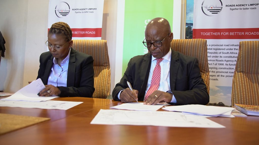 Image: Dr Nombasa Tsengwa, Executive Head of Coal Operations at Exxaro Resources (Left) and CEO of Roads Agency Limpopo Mr Maselaganye Matji (right) sign a Memorandum of Agreement (MoA) for the upgrade of a road in Lephalale, Limpopo